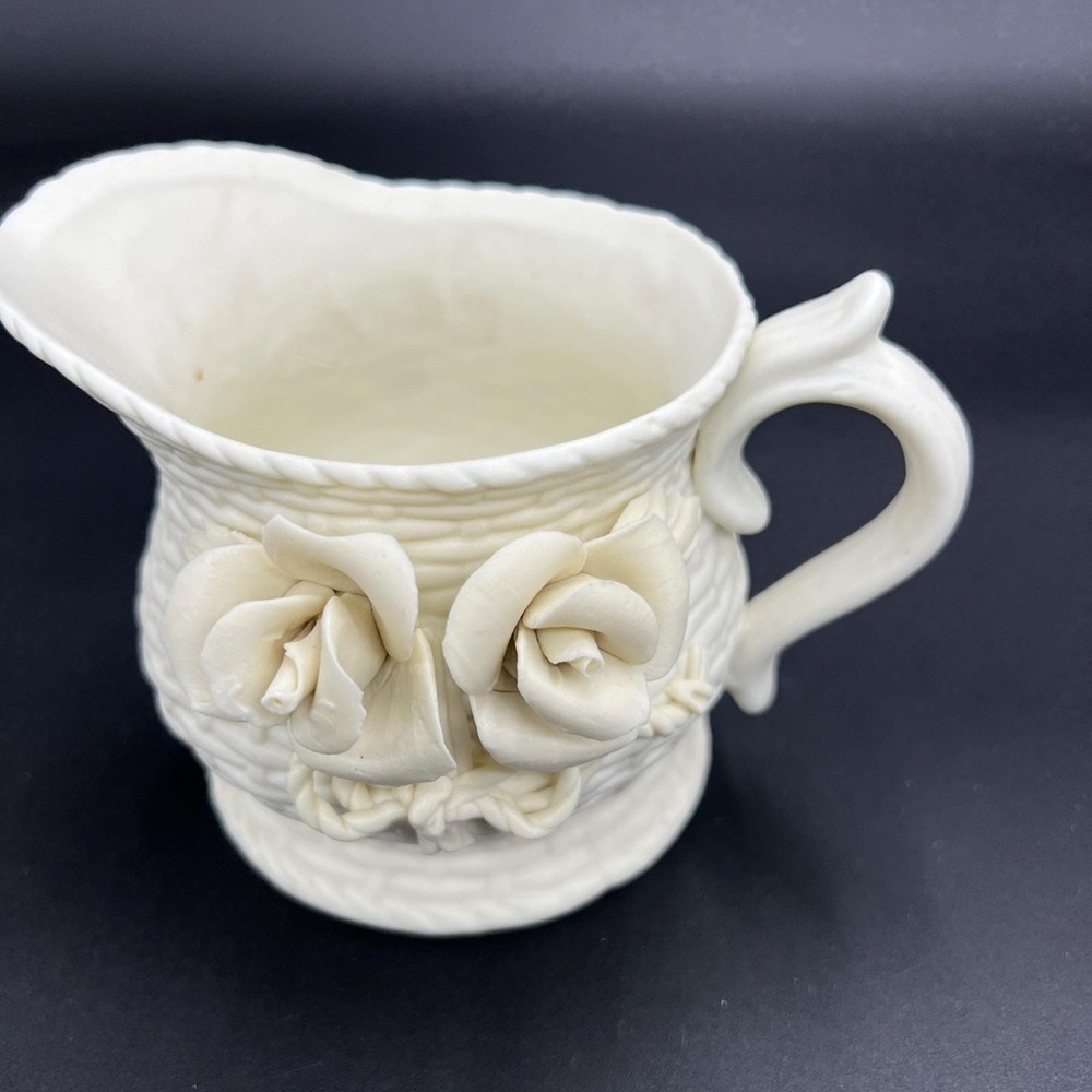 White Ceramic Pitcher With Rose Appliques And Basketweave Design